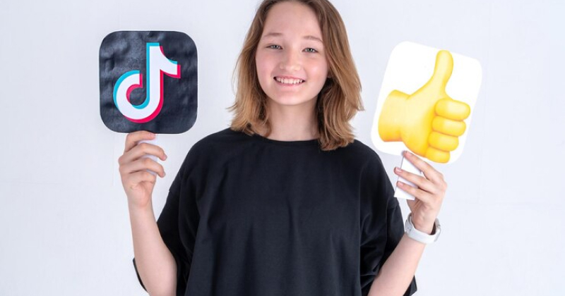 A girl happy with TikTok app