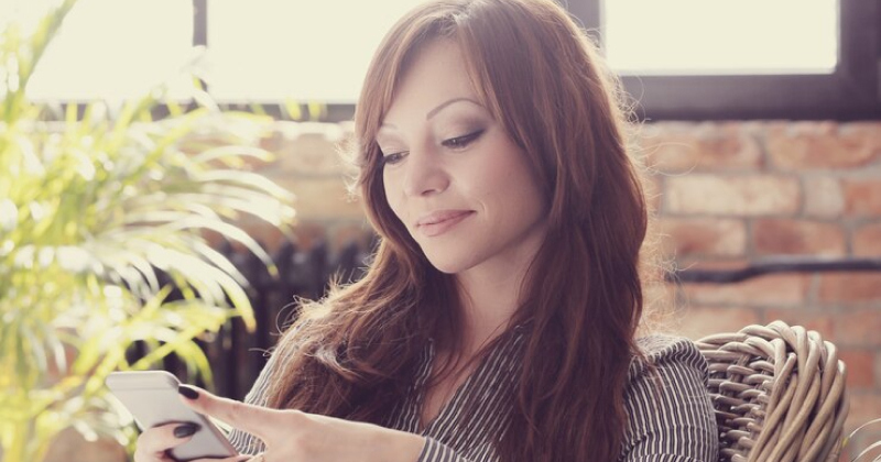 girl checking her phone relax