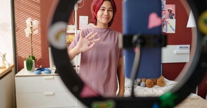 girl recording video for TikTok