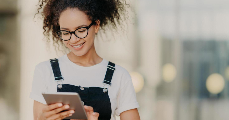 girl checking her phone looking happy
