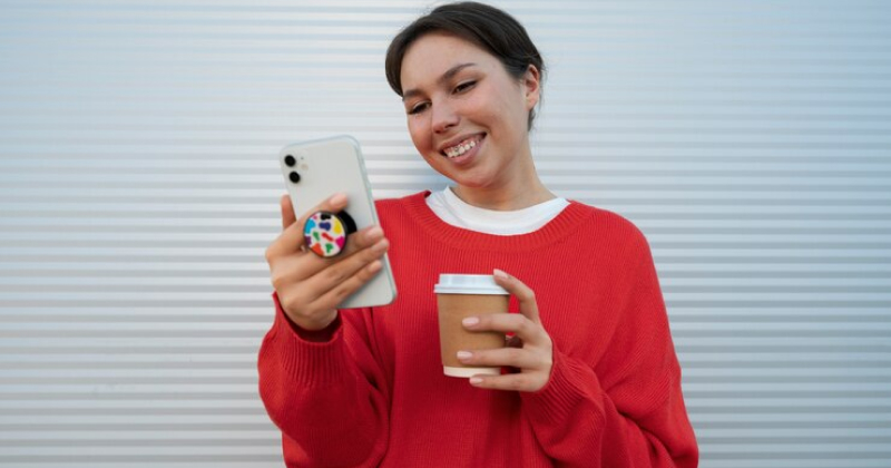 happy girl checking her phone