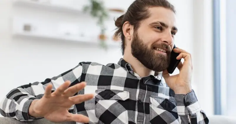 a guy answering his phone
