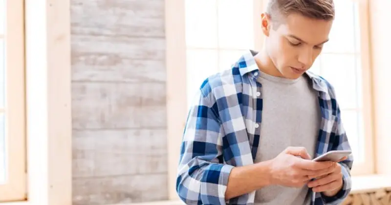 guy checking his phone