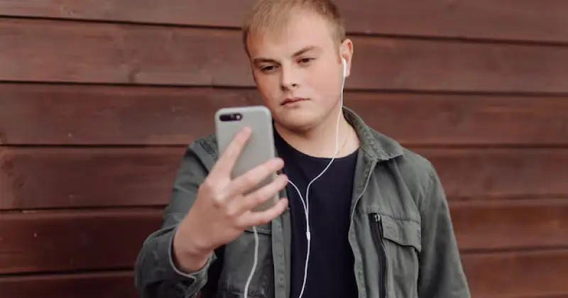 a boy checking his social media platform
