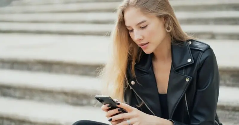girl scrolling on her phone