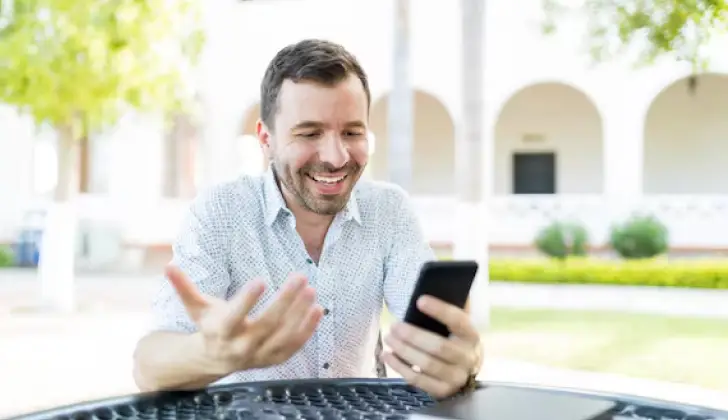 a guy checking his phone