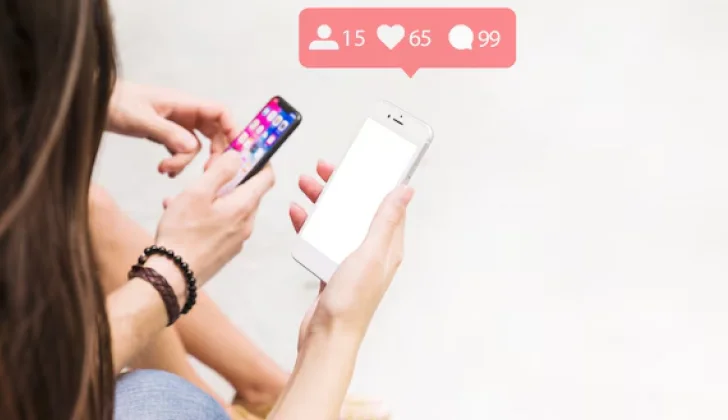 two people checking their social media accounts