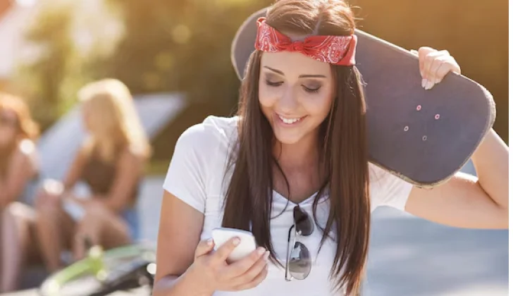 a girl checking her phone in the middle of an activity