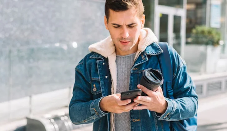 a guy checking his phone
