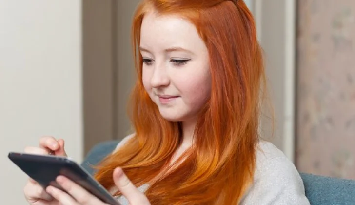 girl scrolling on her phone