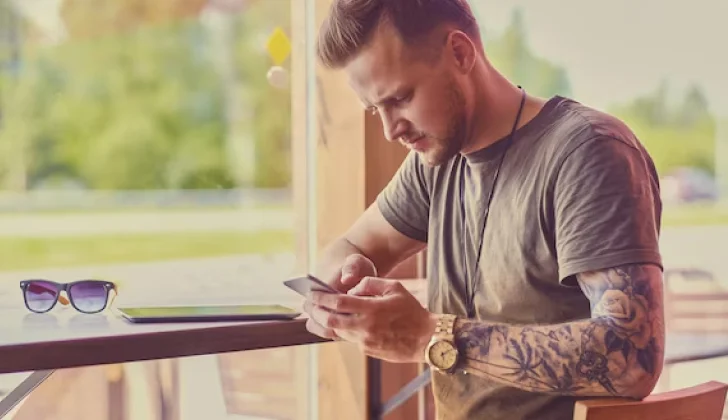 a guy checking his phone