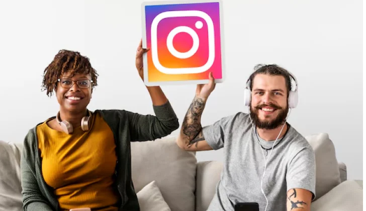 two people holding Instagram sign