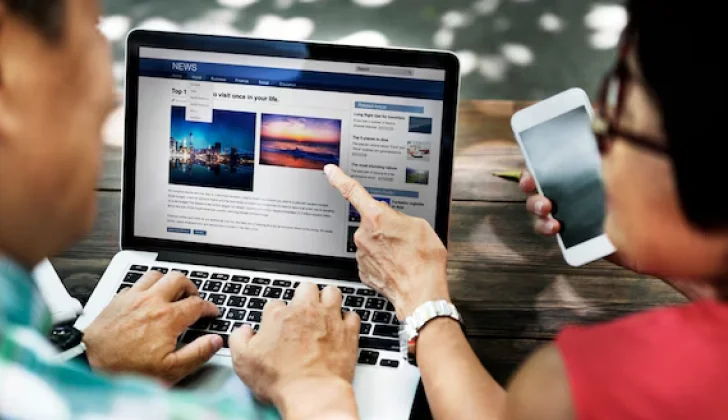 two people checking Facebook