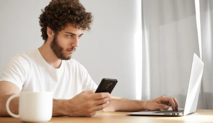 a person working behind the laptop