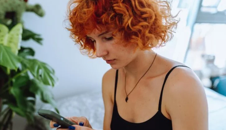 a girl scrolling on her phone