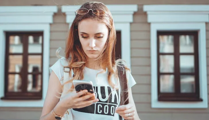 a girl checking her phone