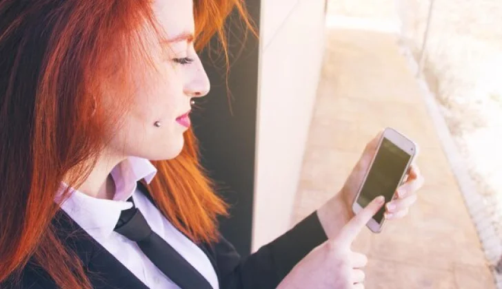 a girl scrolling on her phone