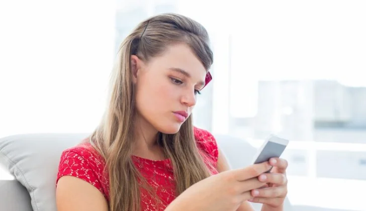 a girl checking her phone