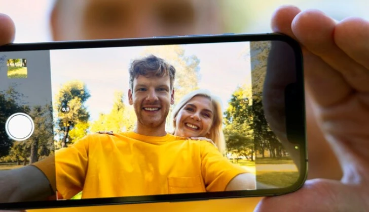 boy and girl taking a video