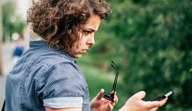 a girl scrolling on her phone