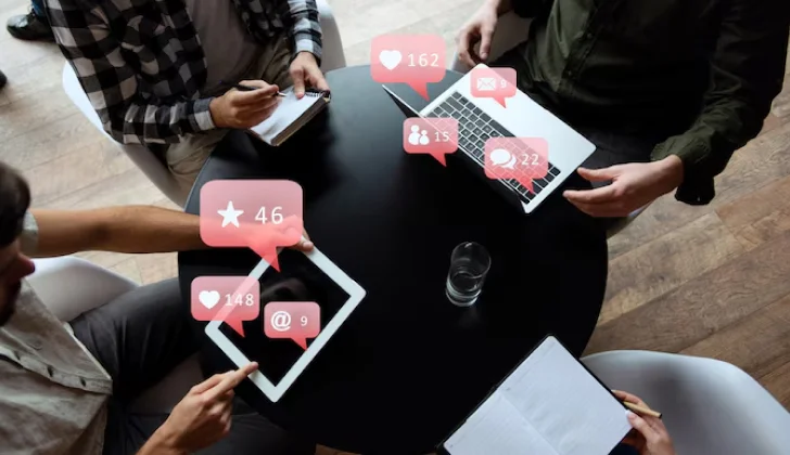 group of people scrolling on social media