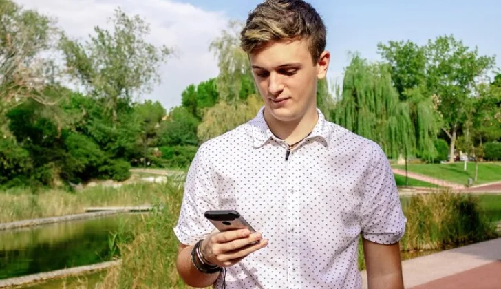 a guy checking phone