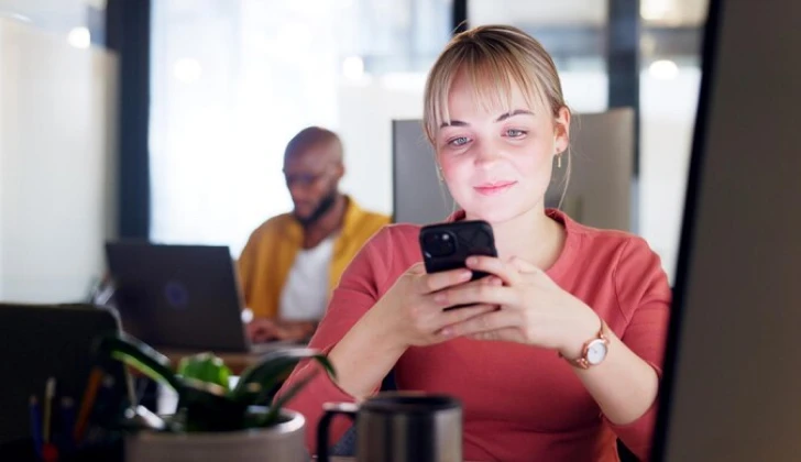a girl typing on her phone