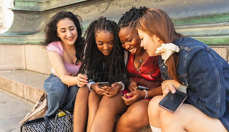 some girls checking social media