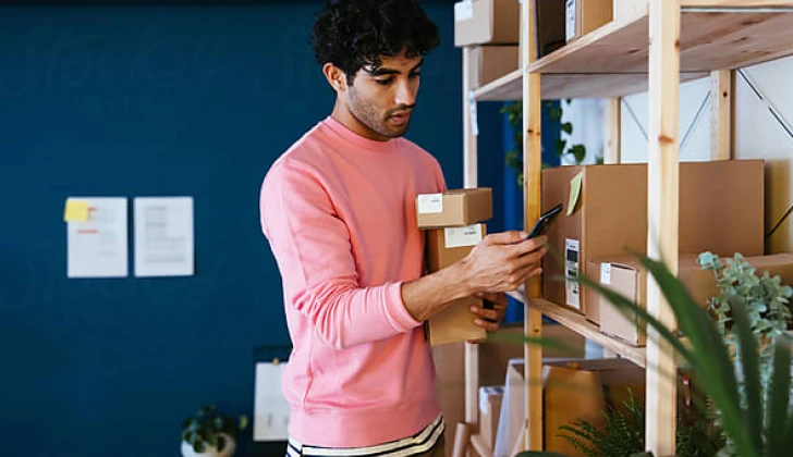 a brand owner checking his phone