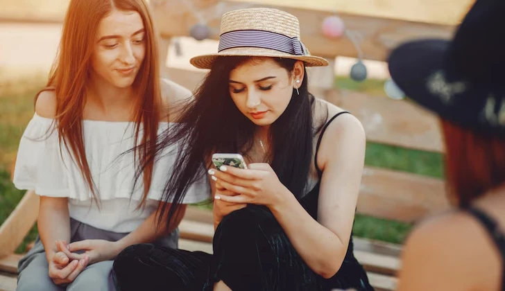 some girls checking their social media