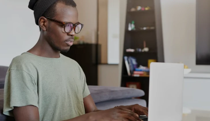 a guy using his laptop