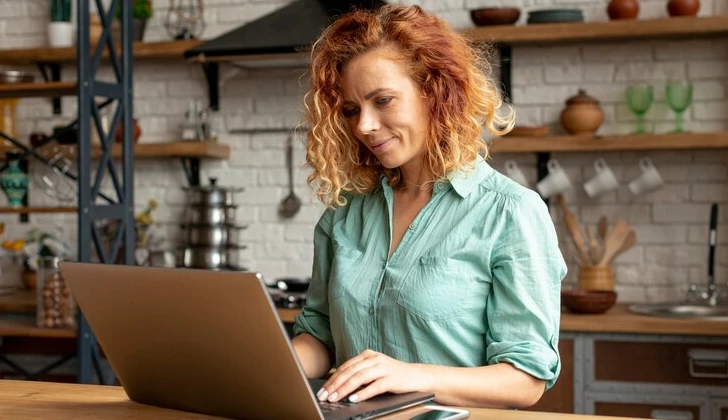 a woman working with laptop