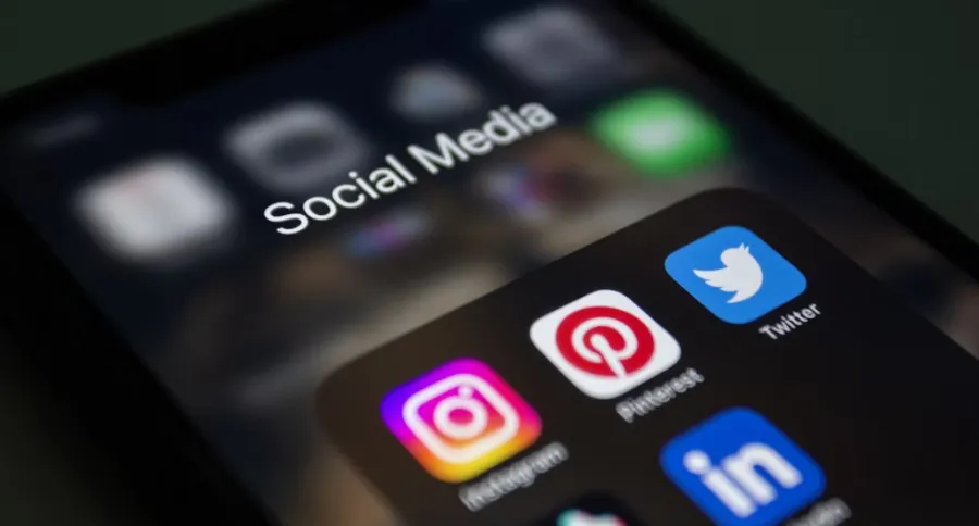 A group of social media apps on a phone screen