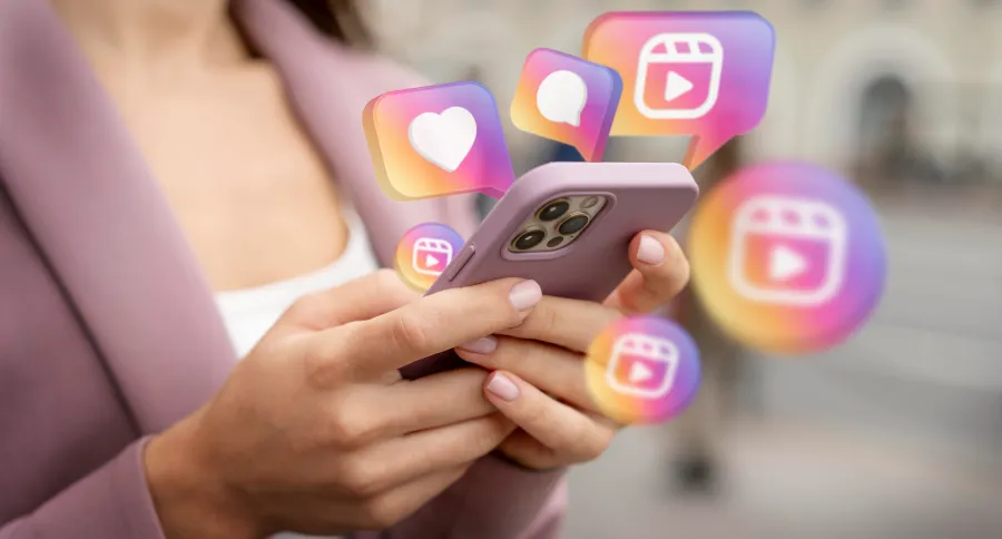 A woman with a pink phone and Instagram symbols around it 
