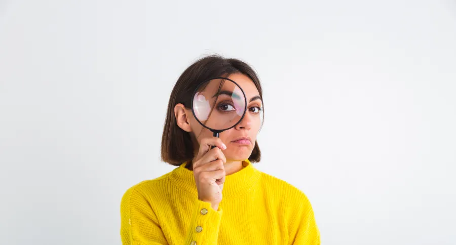 A woman with a magnifying glass