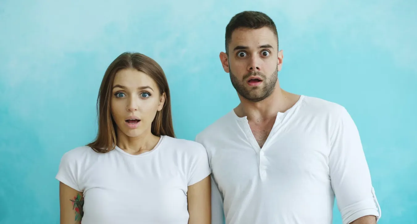 a man and a woman looking shocked