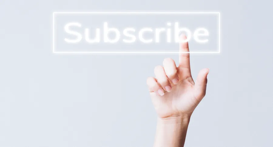A hand pointing to the word subscribe
