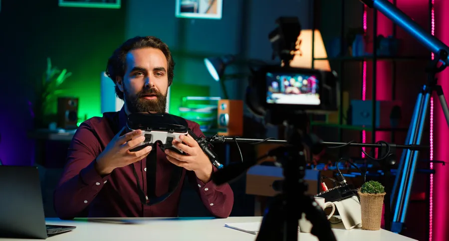 A man talking in front of a camera with a streaming set up