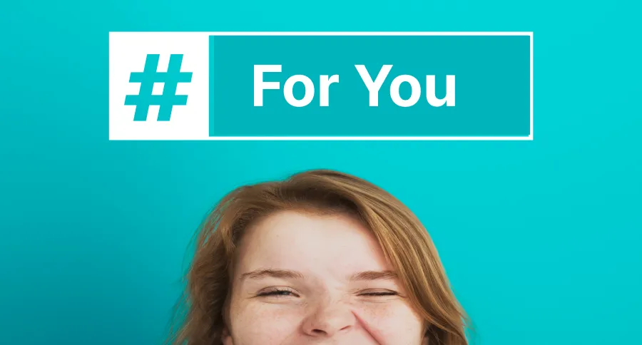 A woman in front of a teal background with a #ForYou above her head