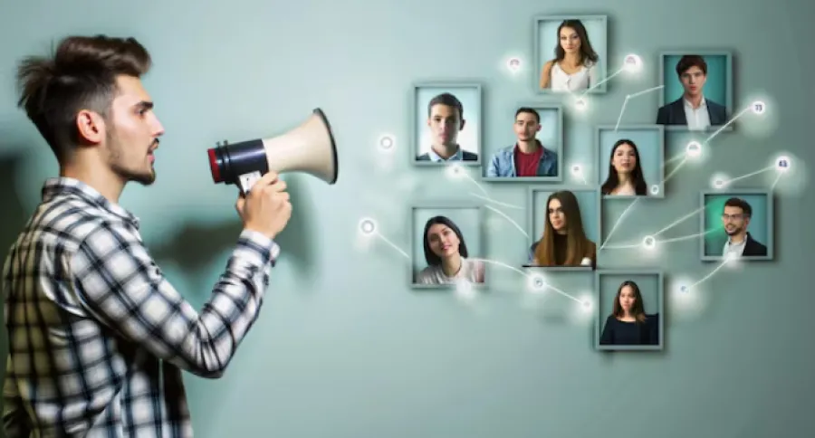 a man holding a megaphone speaking to a bunch of digital profile pictures