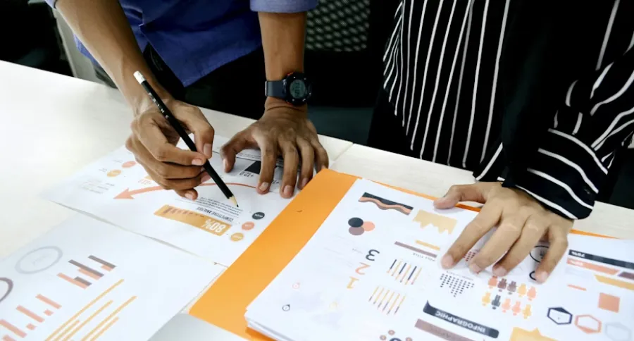 two people analyzing data